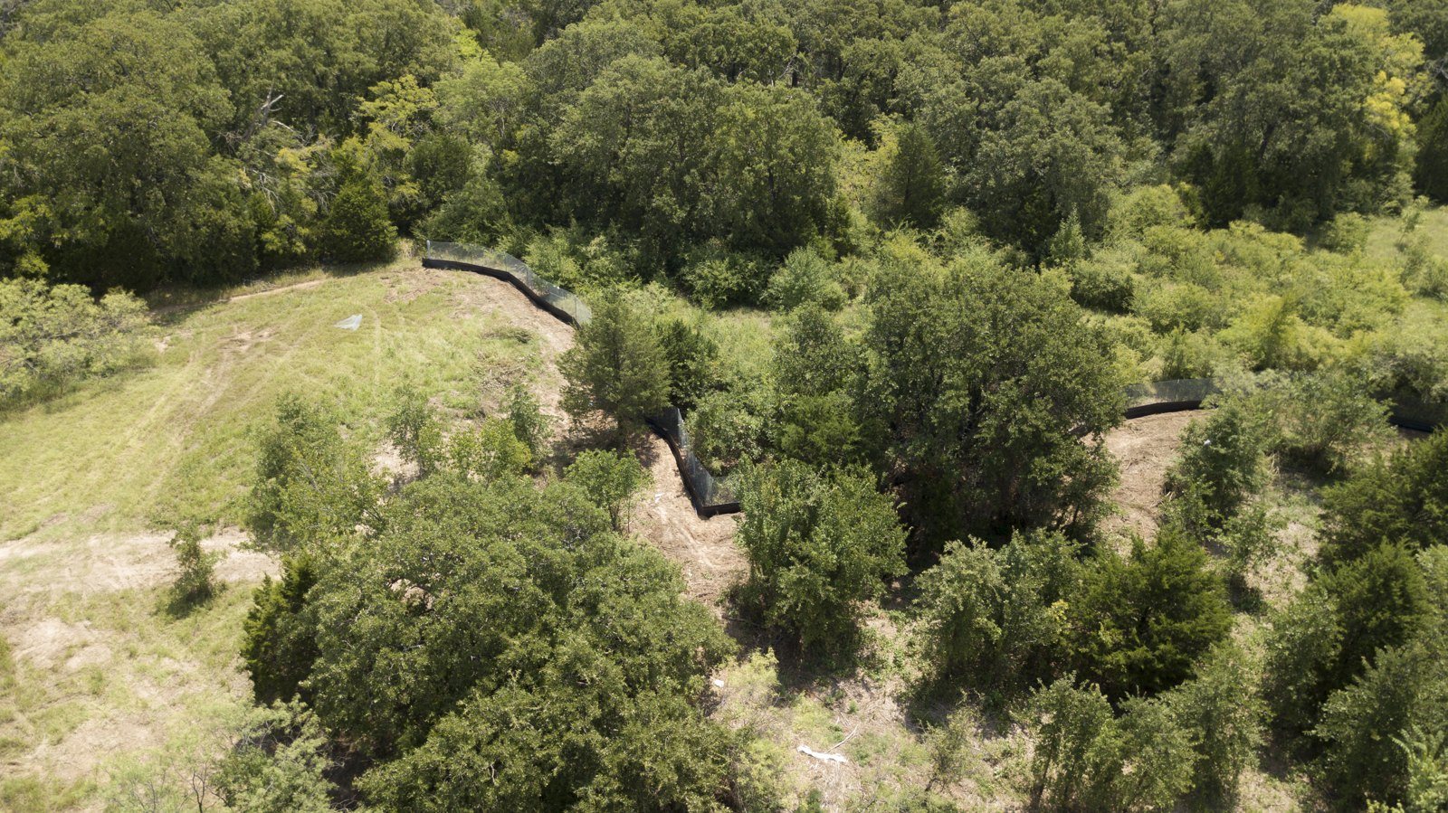 Aerial view of silt fence lines across an active construction site